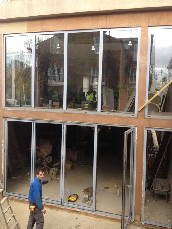 Aluminium bi-fold doors with two-storey glazing in Ascot