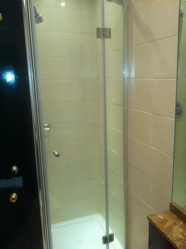 Frameless glass shower enclosure with chrome fittings in Ascot