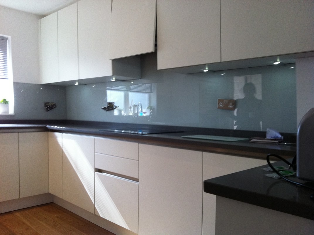 Grey glass kitchen splashback with LED lighting in Ascot