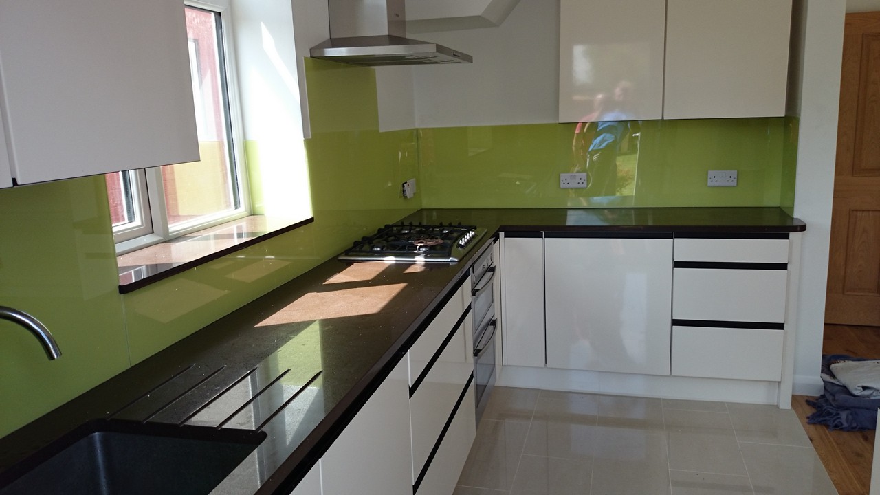Lime green glass kitchen splashback installed by Ascot glaziers