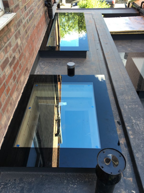 Multiple flat roof skylights on extension in Ascot