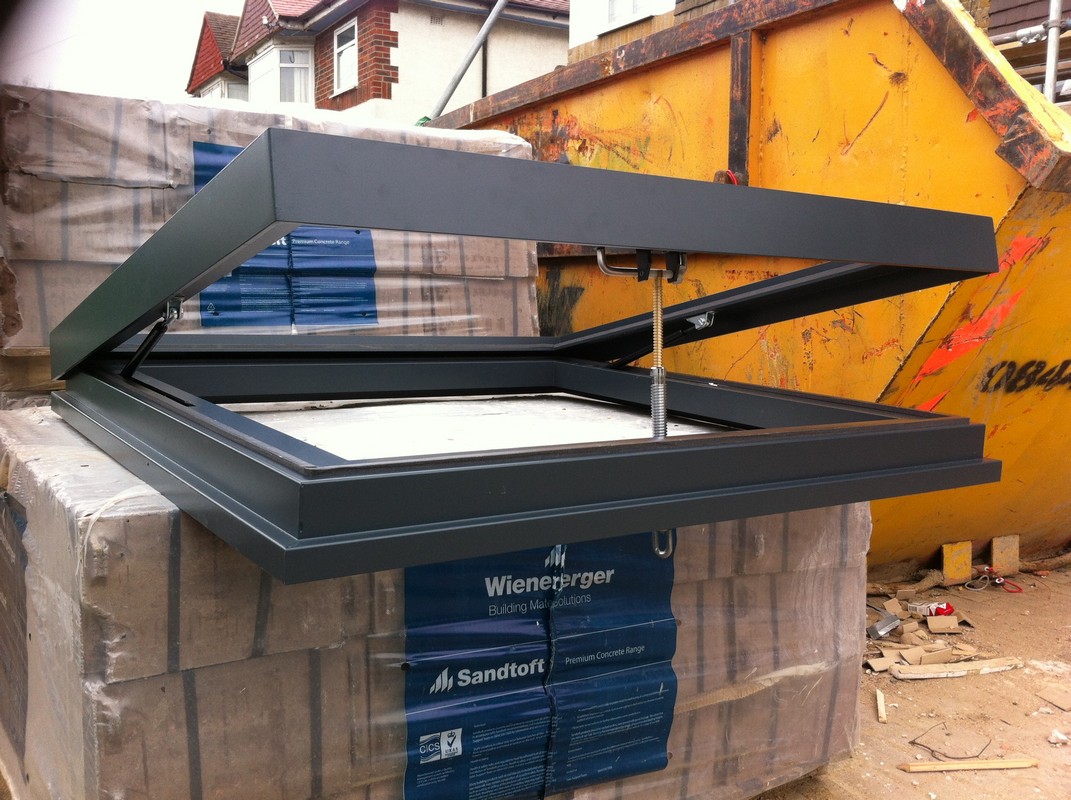 Opening flat roof skylight in anthracite grey installed in Ascot
